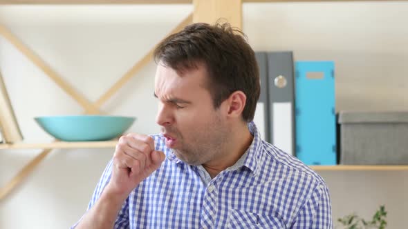 Sick Man Coughing Sitting in Office