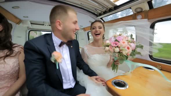 Bridesmaids and Groomsmen Dance While Sitting in the Limousine