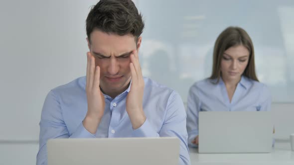 Headache, Upset Businessman in Stress at Work