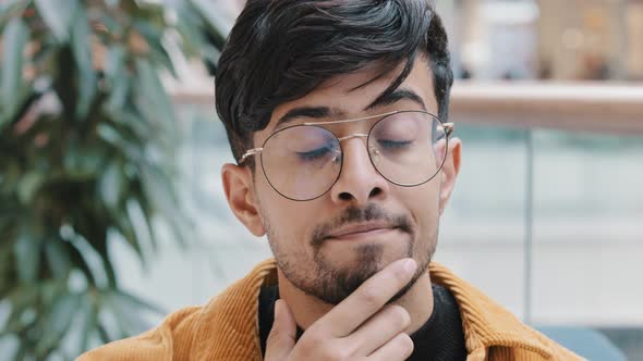 Headshot Young Pensive Thoughtful Indian Man Holding Hand on Chin Thinking Deep in Thought in Search