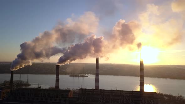 Smoke From Factory Chimneys on Background of Sunset Sky 006