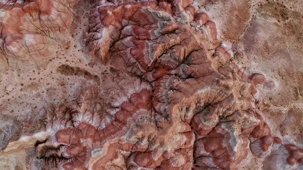 Spiraling down to the ground over red desert landscape in Wyoming