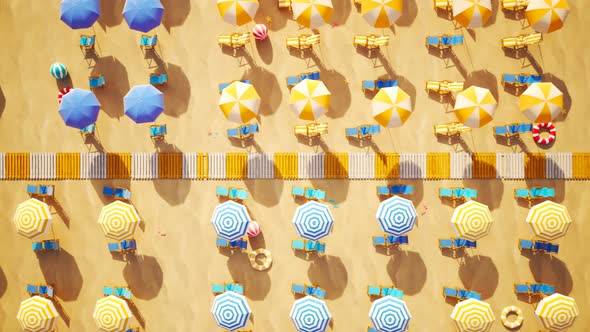 Sunny beach with rows of colorful umbrellas and sunbeds. Looping animation 4KHD