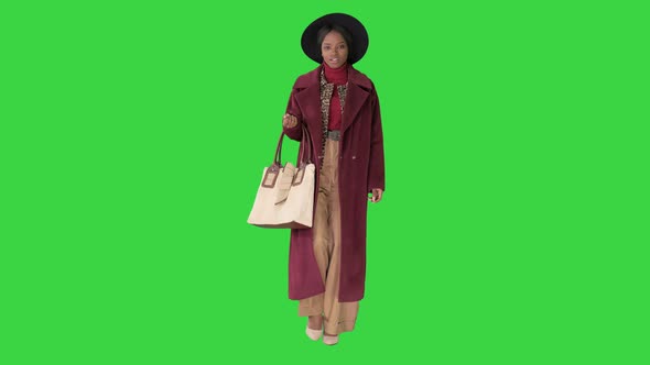 Beautiful African American Woman Walking on a Green Screen Chroma Key