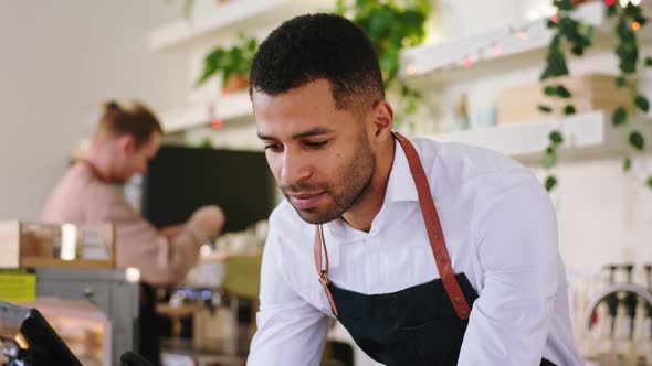 Closeup to the Camera Afro American Man Barista at