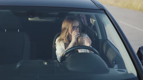 View of Pretty Lady Wears Sunglasses and Seat Belt to Start Car