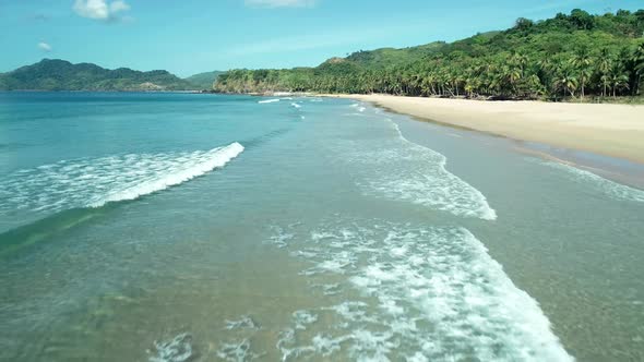 Aerial Drone View of Tropical Paradise Beach with White Sand and Turquoise Crystal Clear Sea Water