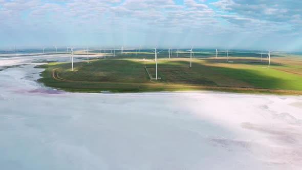 Wind Turbines on the Seashore at Sunset