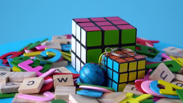 Close up large and small rubik's cube at turntable