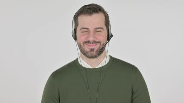 Portrait of Man with Head Set Smiling at Camera White Screen