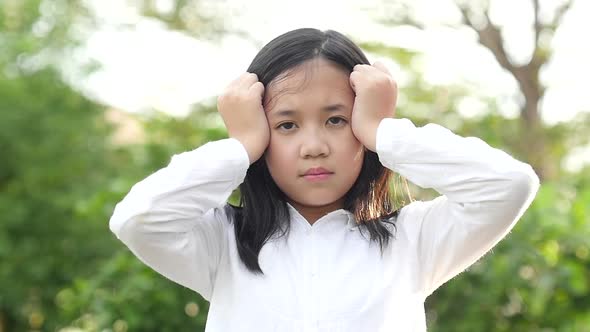 Close Up Portrait Asian Girl Stressed On Nature Background Slow Motion