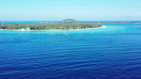 Natural drone island view of a white paradise beach and blue ocean background in colorful 4K