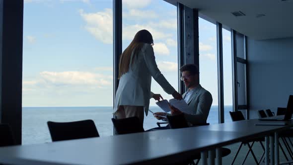 Businesswoman Showing Ceo Papers in Conference Hall