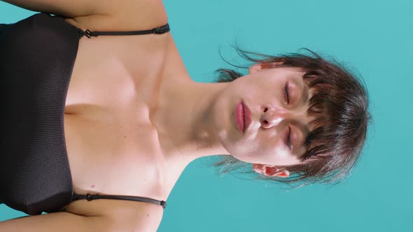 Vertical Video Portrait of Woman Sitting with Eyes Closed and Taking Deep Breaths