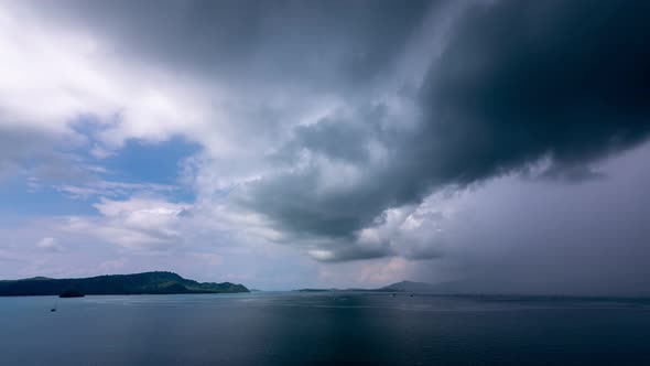 Building motions storm clouds.Dark clouds sky time lapse. Raining storm clouds over sea. Cloudscape