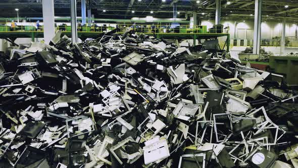 Waste, Plastic Trash, Garbage Recycling Plant. A Pile of Broken Consumer Electronics in a Junkyard