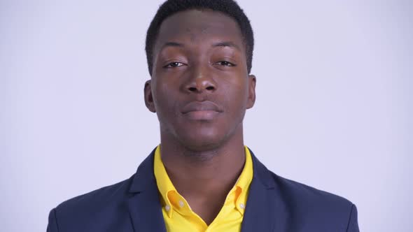 Face of Young Handsome African Businessman in Suit