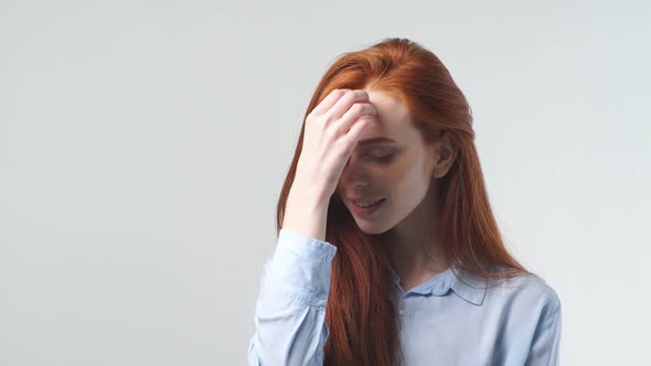 Portrait of Young Beautiful Red-haired Girl on White Background, Smiling, Dancing and Posing for