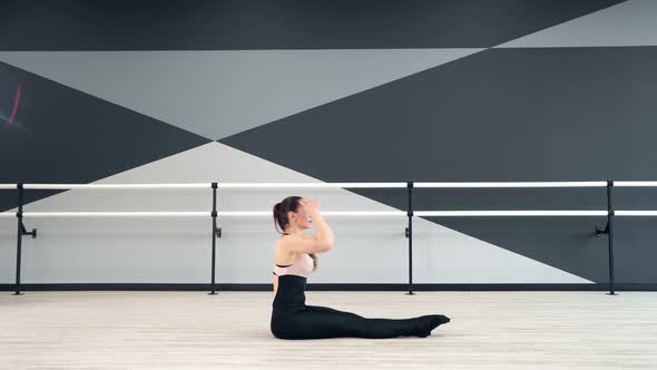 Woman Stretching with Head on Knees