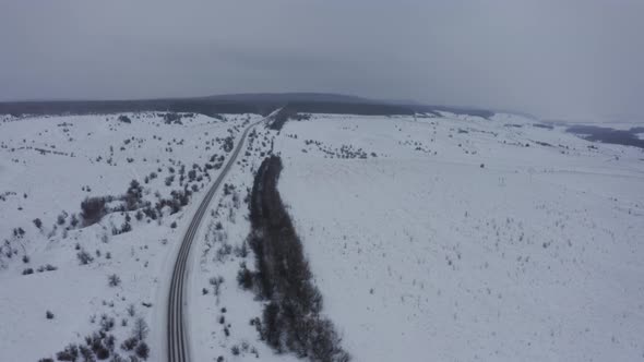 Highway Through Snowcovered Fields and Villages