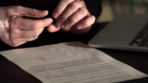Close Up Shot of Man's Hands, Who Leaves Signature on the Agreement.