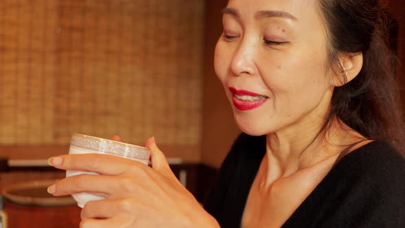 Japanese woman enjoying a coffee