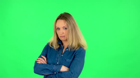 Portrait of Fair Woman Is Standing Offended and Then Smiling. Green Screen