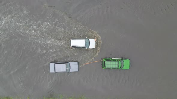 Aerial View of City Traffic with Cars Driving on Flooded Street After Heavy Rain