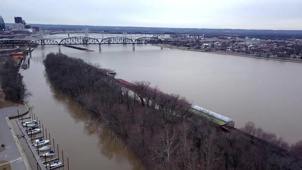 Aerial view of Louisville Kentucky boat port (Ohio river) with motorboats docked and containers seen