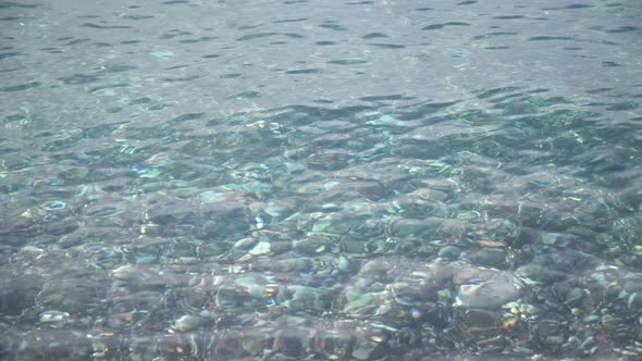 Clear Sea Water Near the Shore. Surf on the Beach