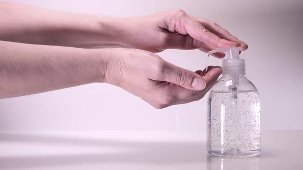 Woman Using A Gel Rubbing An Alternative With Hand Washing.