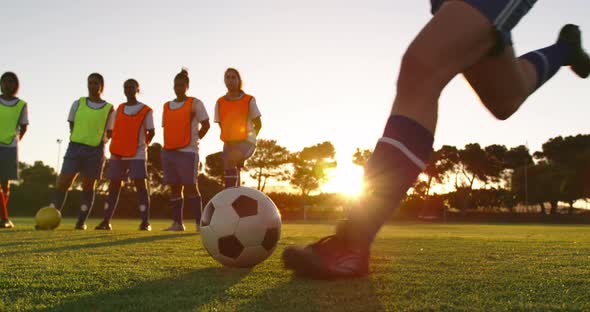 Female soccer player shooting the ball 4k