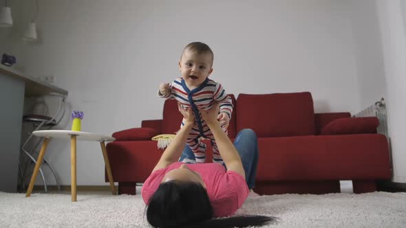 Happy Baby Boy Enjoying with Mother at Home