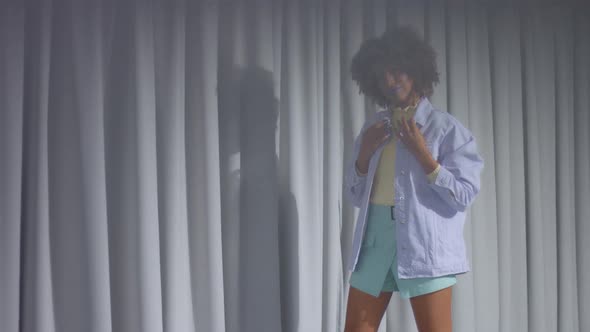 Portrait of Mixed Race Dancer Through the Crystal Wears Pastel Clothes on Grey Curtain Background