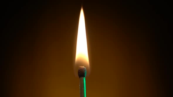 Match Lights Up a Bright Flame and Continues To Burn. Slow Motion