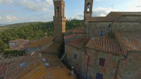 Sky View Of Comune Sinalunga In Tuscany Italy With Historical Buildings Surrounded By Lush Green Mou