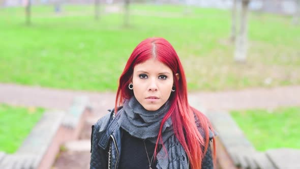 Young redhead girl looking in camera