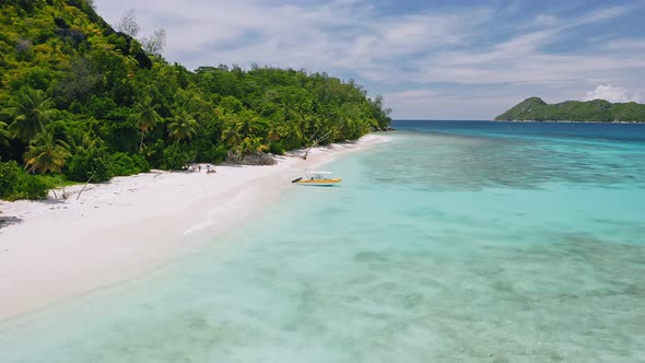 Mahe Seychelles Exotic Beach with Tourist Boat Blue Lagoon and Palm Trees