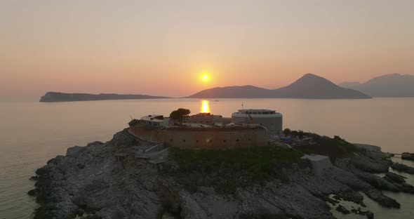 aerial pedestal view of mamula island during sunset