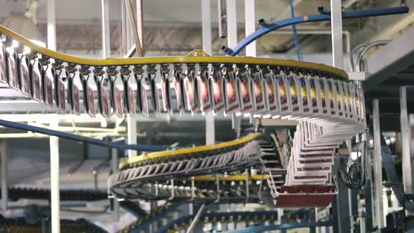 Newspapers on Conveyor Belt at Printing House. Direction From Right To Left.