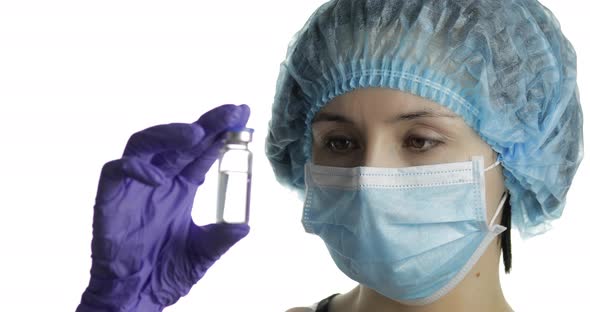 Female Scientist Holding Ampoule in Hand, New Medication Developing, Vaccination