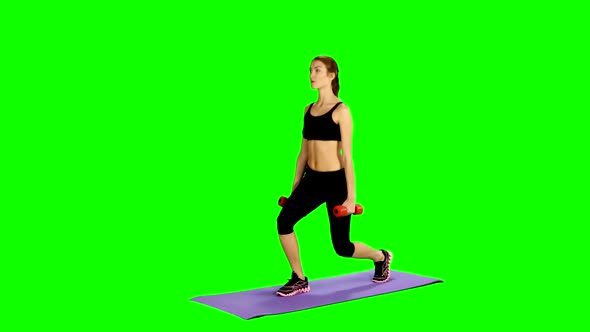 Young Attractive Sporty Woman Doing Sports Attacks on Green Screen