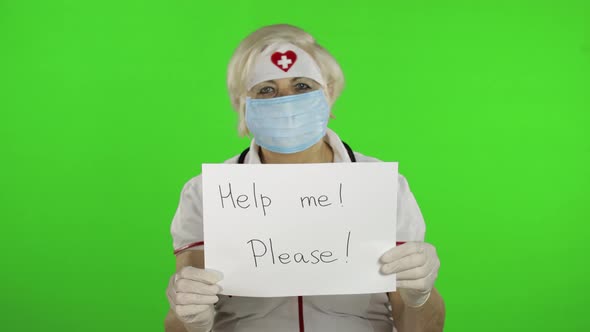 Elderly Female Doctor in Medical Mask Show Page with Message, Coronavirus