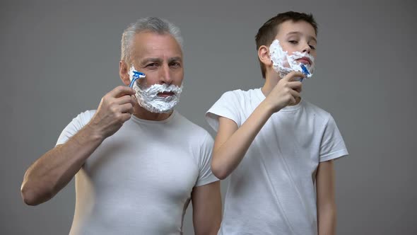 Happy Adult Man and Preteen Boy Shaving, Kid Teaching to Be Man, Morning Ritual