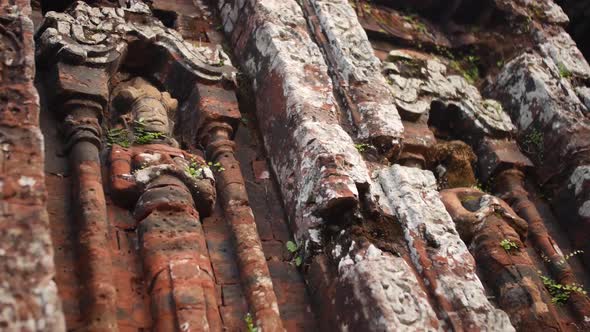 My Son Temple, Vietnam - Dilapidated Stone Wall Carvings With Statues Of Lord Shiva - Low-Angle Shot