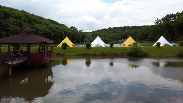 Wooden gazebo in the middle of the lake.