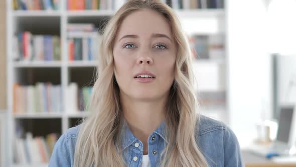 Young Woman Gesturing No By Shaking Head