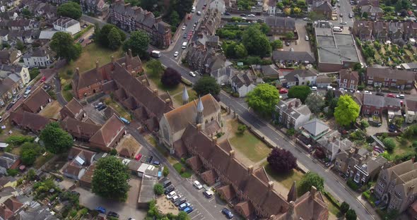 Aerial pan up reveal of Faversham town, Kent, UK