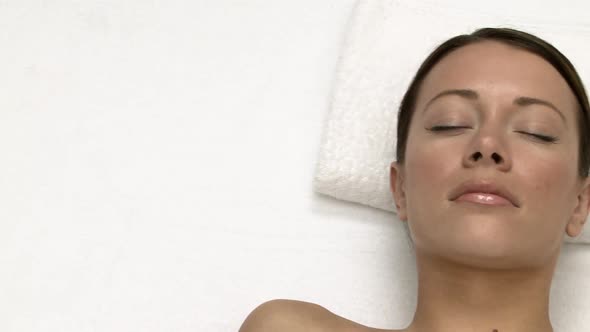 Woman lying on massage table