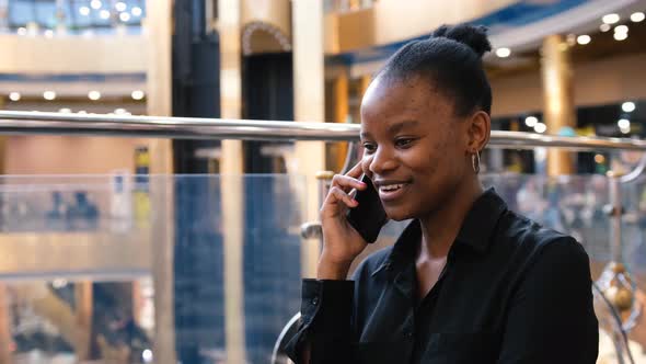 Attractive African Woman Talking on Mobile Phone